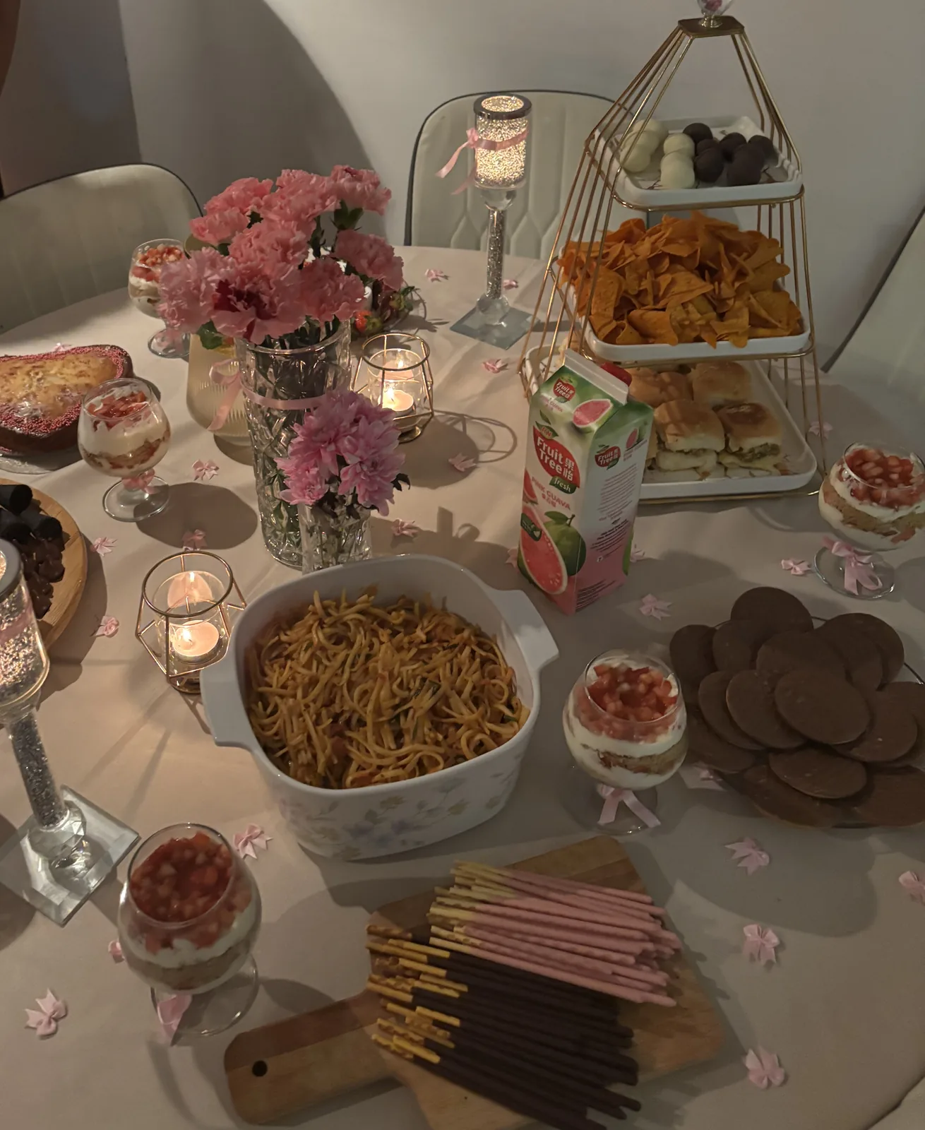Galentine’s party table styled by Ghanjani Jain with pink florals and candlelight