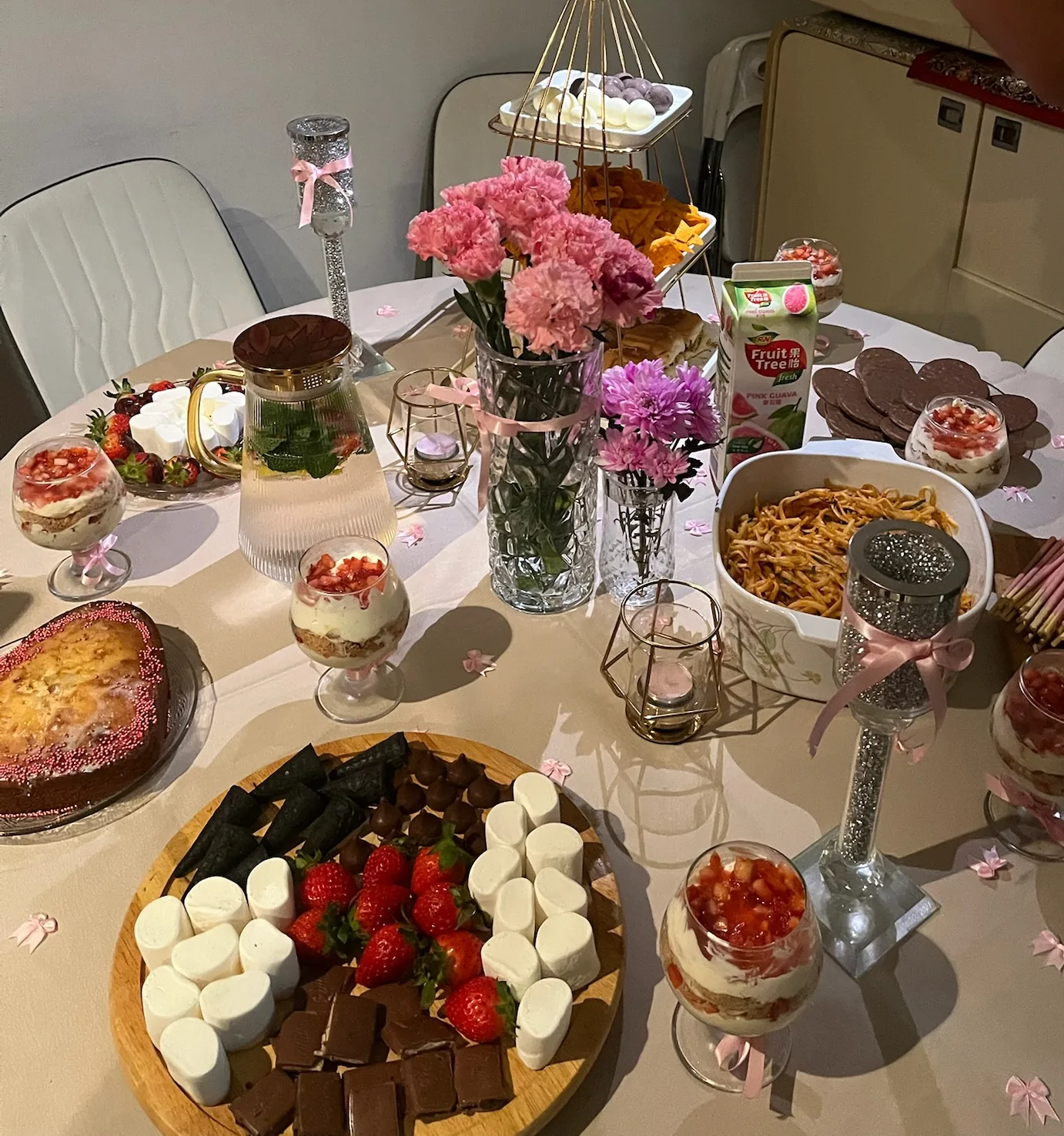 Wide view of Ghanjani Jain’s Galentine’s party table and pink décor